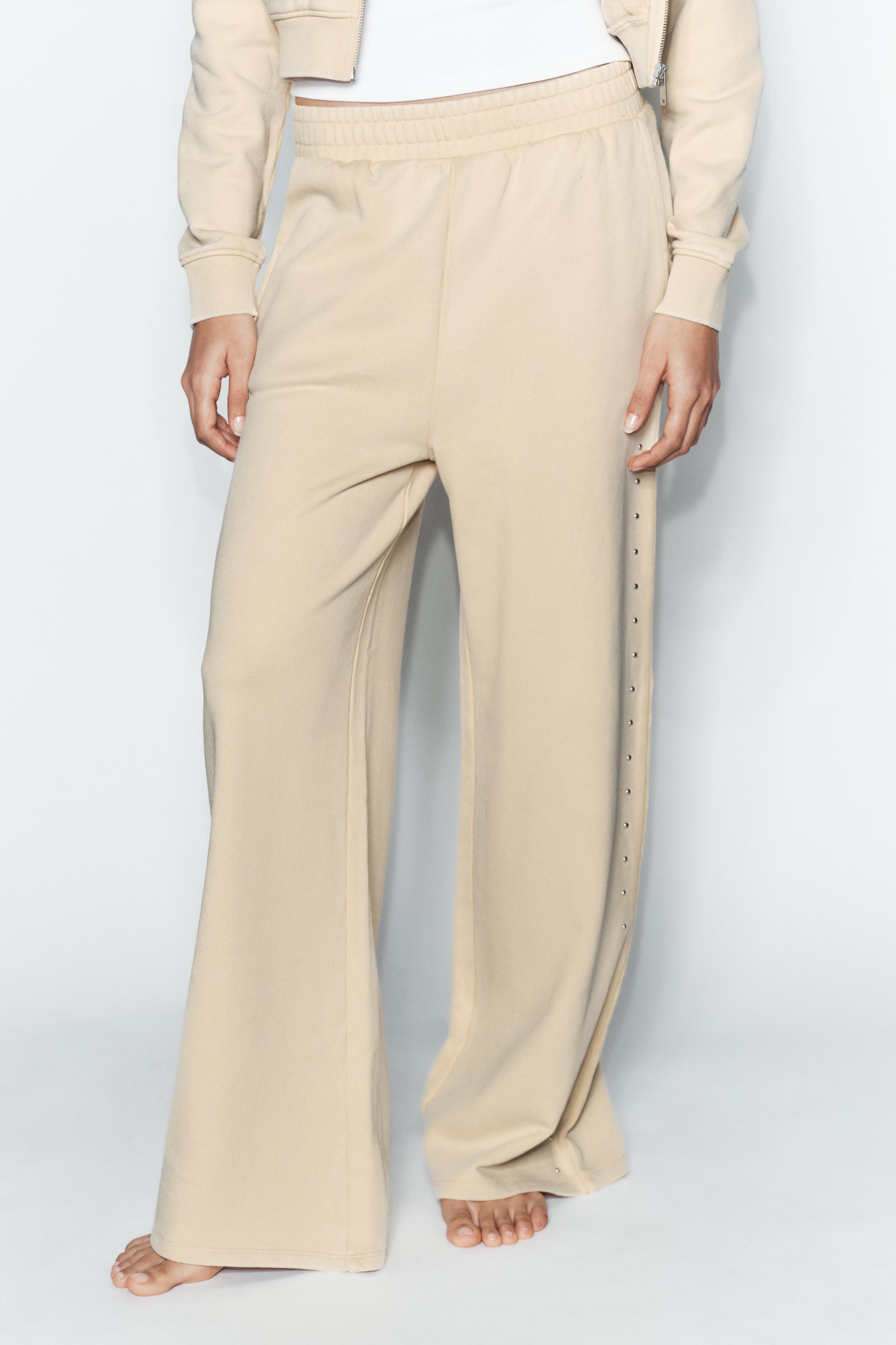 PANTALON EN MOLLETON EFFET DÉLAVÉ CLOUS